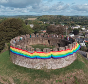 Check out a British castle wrapped in a giant rainbow flag for a local Pride festival
